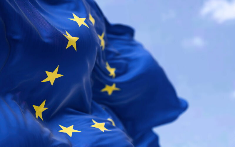 The flag of The European Union flapping in the wind. Economic and finance Community. Politics and Economy. Transnational political government