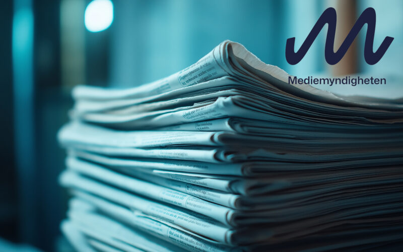 Stack of newspapers in a soft blue light, emphasizing the textur
